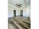 Generously sized main bedroom boasting tray ceiling, new floors, and ensuite bathroom at 7292 Hemlock Loop, Ocala, FL 34472