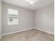 Bright, neutrally painted bedroom with a ceiling fan and a window at 7987 Sw 89Th Cir, Ocala, FL 34481