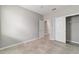 Neutrally painted bedroom with tile flooring, a ceiling fan and a closet at 7987 Sw 89Th Cir, Ocala, FL 34481