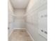 A walk-in closet with wire shelving, neutral paint, and tile floors at 7987 Sw 89Th Cir, Ocala, FL 34481