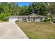 Charming single-story home featuring a welcoming front porch and well-maintained landscaping at 8137 Sw 117Th Loop, Ocala, FL 34481