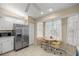 Cozy kitchen nook area featuring stainless steel appliances and a breakfast table with chairs at 8137 Sw 117Th Loop, Ocala, FL 34481