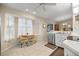 Bright eat-in kitchen featuring a dining nook with a bay window, stainless steel appliances, and tile flooring at 8137 Sw 117Th Loop, Ocala, FL 34481