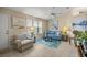 Bright and airy living room with tile flooring, large windows, and stylish decor at 8137 Sw 117Th Loop, Ocala, FL 34481
