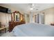 Large main bedroom featuring a television, ceiling fan, tile floors and ensuite bathroom access at 8137 Sw 117Th Loop, Ocala, FL 34481
