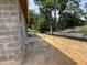 View of the yard with the concrete block walls, awaiting landscaping at 85 Nw 45Th Loop, Ocala, FL 34475