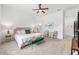 Tranquil bedroom featuring a plush bed, a ceiling fan, and neutral tones at 8809 Sw 61St Loop, Ocala, FL 34481
