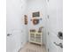 Inviting entryway with decorative accents and storage cabinet, creating a warm and welcoming atmosphere at 8809 Sw 61St Loop, Ocala, FL 34481