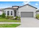 Charming single-story home with a well-manicured front yard and a two-car garage at 8809 Sw 61St Loop, Ocala, FL 34481