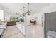 Bright, open-concept kitchen featuring a large island with granite countertops and stainless steel appliances at 8809 Sw 61St Loop, Ocala, FL 34481