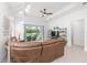 Comfortable living room space with large sofa and a view to the outdoor patio at 8809 Sw 61St Loop, Ocala, FL 34481