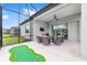 Large screened patio featuring putting green at 8809 Sw 61St Loop, Ocala, FL 34481