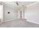 Neutral bedroom featuring a ceiling fan and view of doorways at 9777 Sw 63Rd Loop, Ocala, FL 34481