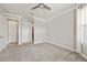 Neutral bedroom featuring large windows and view of doorways at 9777 Sw 63Rd Loop, Ocala, FL 34481