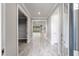Inviting foyer showcasing elegant tile flooring and views into the open-concept living spaces at 9777 Sw 63Rd Loop, Ocala, FL 34481