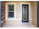 Charming front entrance featuring a stylish door with decorative glass and a sidelight window at 9777 Sw 63Rd Loop, Ocala, FL 34481