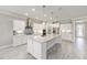 Bright kitchen with stainless steel appliances, granite countertops, and a center island with pendant lighting at 9777 Sw 63Rd Loop, Ocala, FL 34481