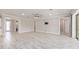 Spacious living room with tile flooring, neutral paint, recessed lights and open access to other areas of the home at 9777 Sw 63Rd Loop, Ocala, FL 34481