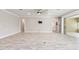 Spacious living room featuring tile flooring and a ceiling fan at 9777 Sw 63Rd Loop, Ocala, FL 34481