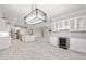 Expansive open floorplan with modern lighting, updated kitchen and a convenient beverage center at 9777 Sw 63Rd Loop, Ocala, FL 34481