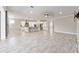 Open-concept living space combining the kitchen and living room, perfect for entertaining at 9777 Sw 63Rd Loop, Ocala, FL 34481