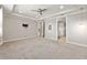 Serene bedroom with neutral walls, plush carpeting and doorways leading to ensuite bathroom and walk-in closet at 9777 Sw 63Rd Loop, Ocala, FL 34481