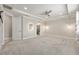Serene bedroom with neutral walls, plush carpeting, and doorways leading to ensuite bathroom and walk-in closet at 9777 Sw 63Rd Loop, Ocala, FL 34481