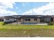 Backyard featuring a screened-in pool with a hot tub at 9777 Sw 63Rd Loop, Ocala, FL 34481