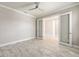 Open room featuring tile floors and double glass doors at 9777 Sw 63Rd Loop, Ocala, FL 34481