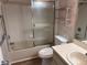 Bathroom with shower-tub combination, white vanity, and decorative pink shelving at 9801 Sw 88Th Ter # B, Ocala, FL 34481