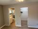 Bright bedroom showcasing a walk-in closet and an ensuite bathroom at 9801 Sw 88Th Ter # B, Ocala, FL 34481