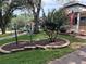 Scenic view of a well-maintained front yard showcasing lush greenery and charming landscaping at 9801 Sw 88Th Ter # B, Ocala, FL 34481