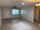 Bright living room featuring modern laminate flooring, neutral paint and natural light at 9801 Sw 88Th Ter # B, Ocala, FL 34481