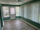 Enclosed sunroom boasting ample windows, ceiling fan and durable floors at 9801 Sw 88Th Ter # B, Ocala, FL 34481