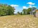 Grassy backyard with mature trees and lush greenery, offering privacy and tranquility, adjacent to the house at 10520 Sw 85Th Ter, Ocala, FL 34481