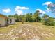 Well-maintained lawn with mature trees, complementing the home's exterior and creating a serene atmosphere at 10520 Sw 85Th Ter, Ocala, FL 34481