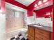 Full bathroom featuring a tiled shower and flooring, and vanity with dark countertop at 10520 Sw 85Th Ter, Ocala, FL 34481