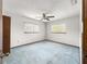 Large bedroom with two windows and ceiling fan offers plenty of natural light at 10520 Sw 85Th Ter, Ocala, FL 34481