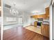 Open kitchen connected to the living area with hardwood floors and lots of natural light at 10520 Sw 85Th Ter, Ocala, FL 34481