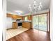 Eat-in kitchen featuring wood cabinetry, stainless steel appliances, and sliding glass doors at 10520 Sw 85Th Ter, Ocala, FL 34481