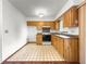 Functional kitchen with wood cabinets, ample counter space, and modern appliances at 10520 Sw 85Th Ter, Ocala, FL 34481