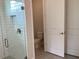 Modern bathroom showcasing the glass shower and adjacent toilet at 10540 Sw 49Th Avenue Rd, Ocala, FL 34476
