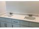 Bathroom featuring a double sink vanity, white cabinets, and modern faucets at 10540 Sw 49Th Avenue Rd, Ocala, FL 34476