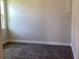 Neutral bedroom featuring gray carpet and simple base trim at 10540 Sw 49Th Avenue Rd, Ocala, FL 34476
