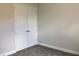 This carpeted bedroom features a closet with double doors and a neutral color palette at 10540 Sw 49Th Avenue Rd, Ocala, FL 34476
