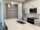 Bright kitchen features a walk-in pantry, white cabinets and stainless steel appliances at 10540 Sw 49Th Avenue Rd, Ocala, FL 34476
