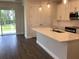 Bright kitchen with a breakfast bar island that opens to living room and backyard at 10540 Sw 49Th Avenue Rd, Ocala, FL 34476