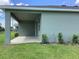 Covered patio with a concrete slab and a view of the well-maintained backyard at 10540 Sw 49Th Avenue Rd, Ocala, FL 34476
