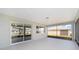 Screened lanai with sliding glass doors provides indoor outdoor space at 10625 Sw 98Th Pl, Ocala, FL 34481