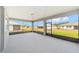 Screened in lanai shows view of the yard and surrounding homes at 10625 Sw 98Th Pl, Ocala, FL 34481